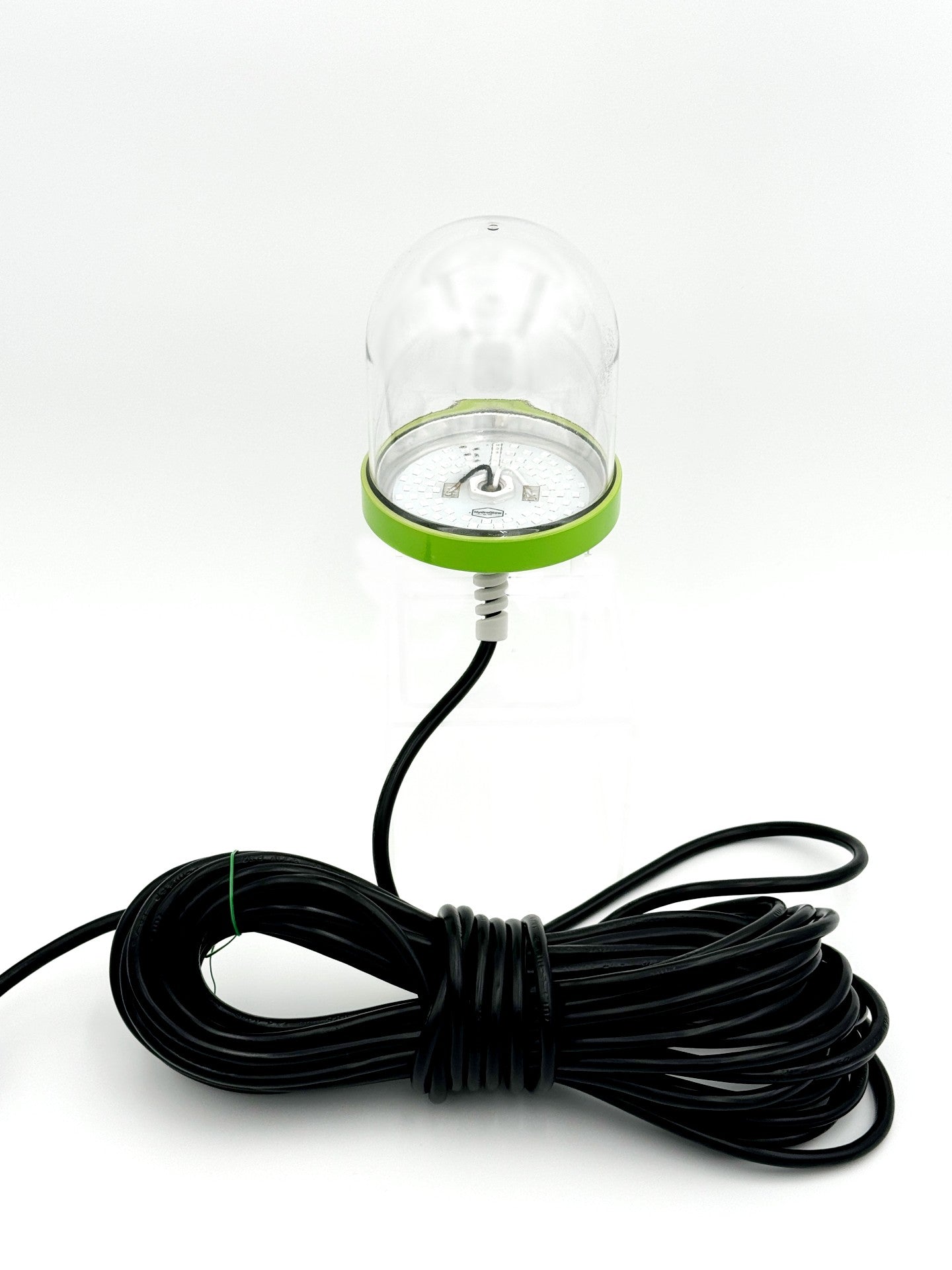 Sea floor green underwater dock light creating a glow for night fishing