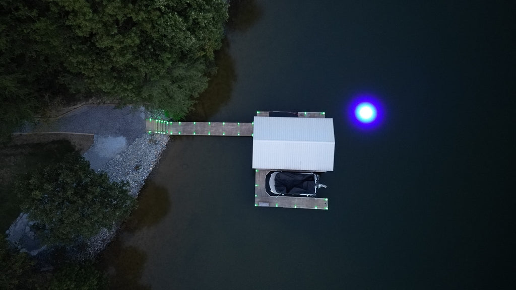 Sea floor blue underwater dock light creating a glow for night fishing