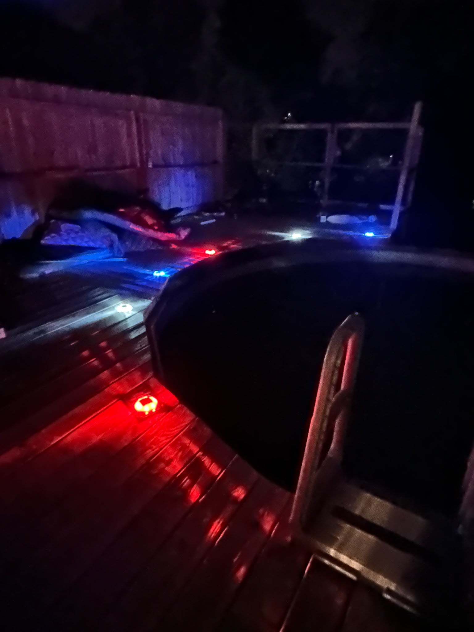 Low‑profile solar dock light marking the edge of a pier at night