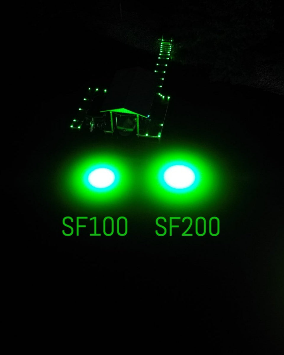 Sea floor green underwater dock light creating a glow for night fishing