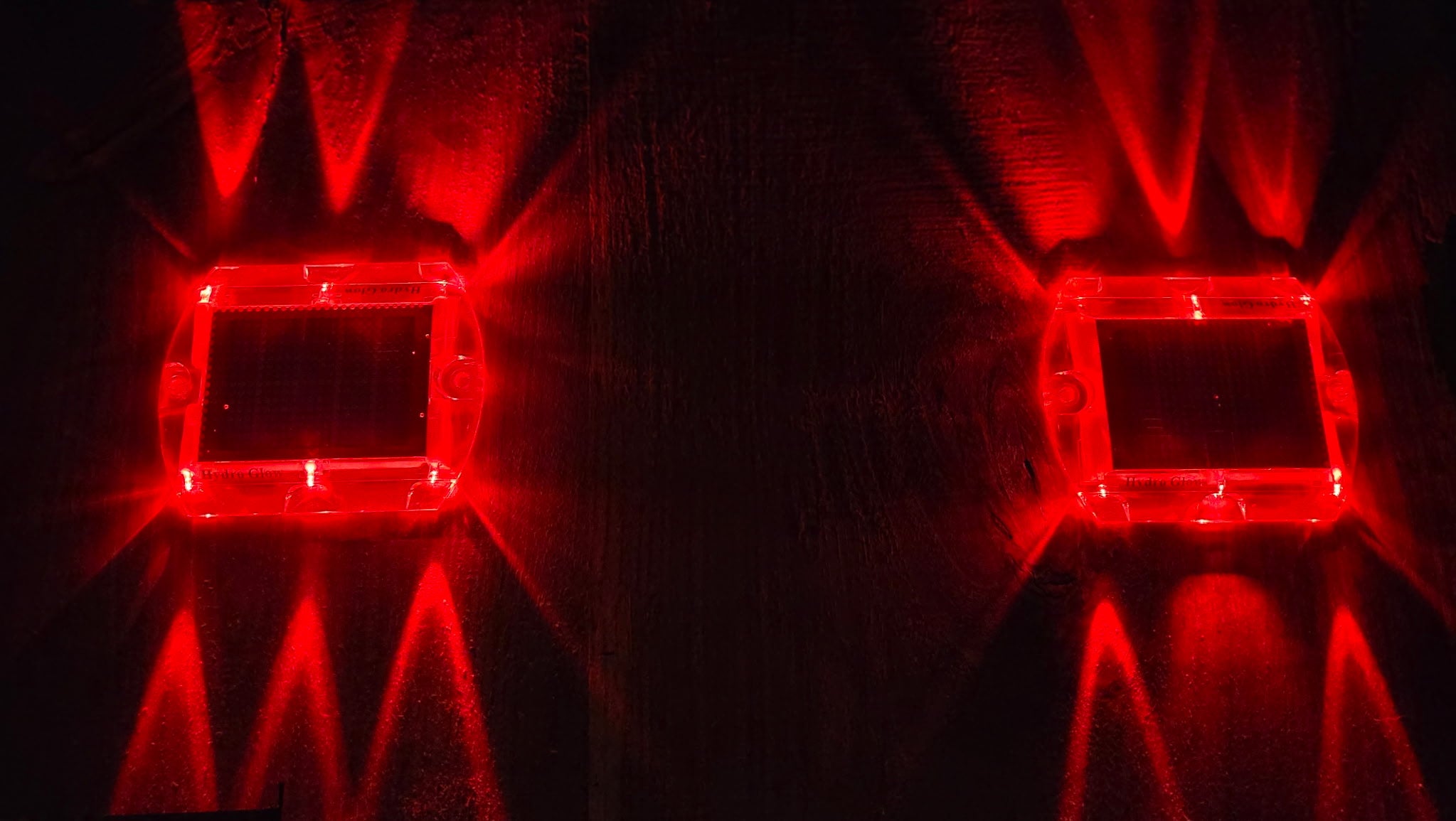 Low‑profile solar dock light marking the edge of a pier at night.