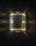 Low‑profile solar dock light marking the edge of a pier at night