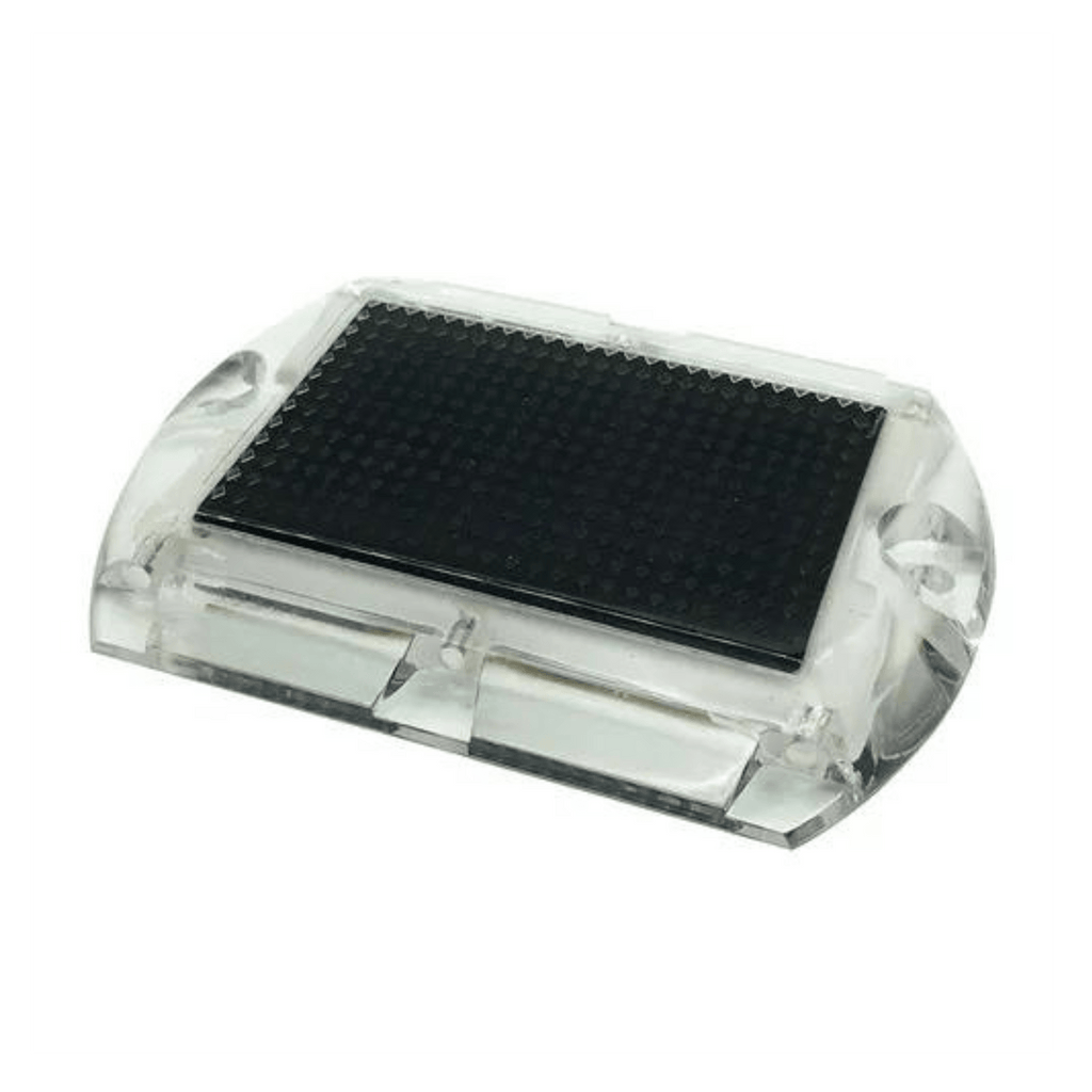 Low‑profile solar dock light marking the edge of a pier at night